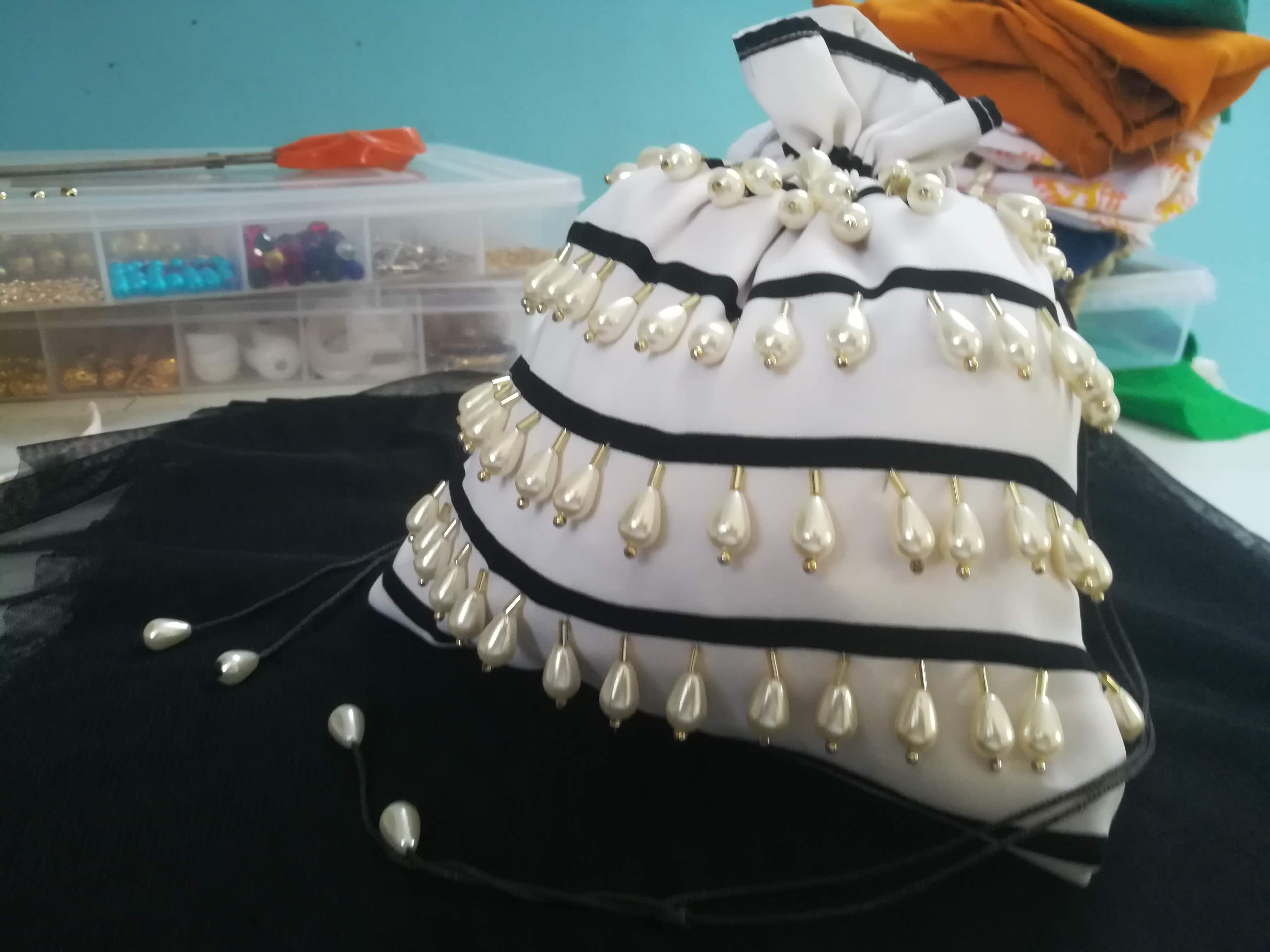 Striped polti bag with hand embroidered tassel